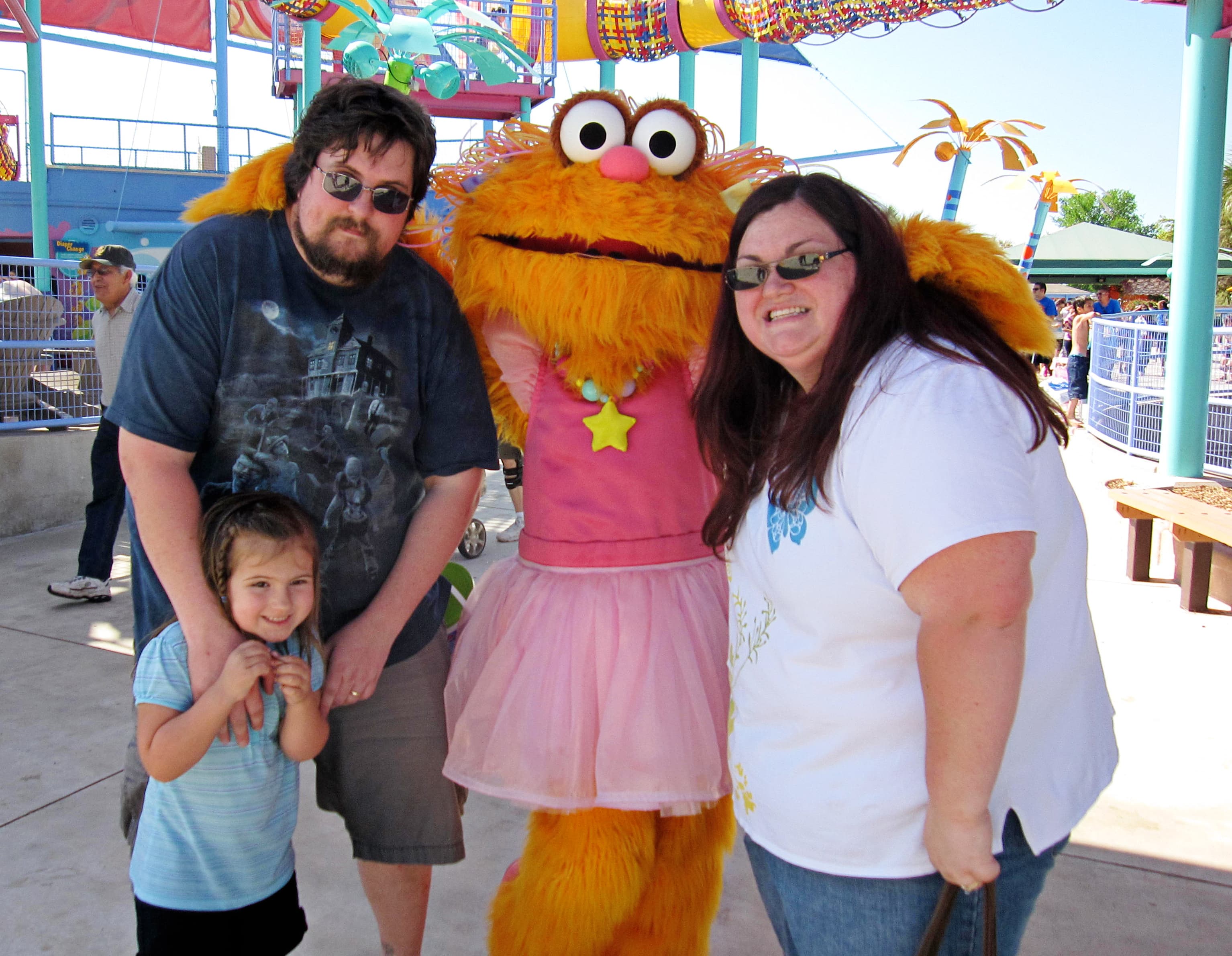 Chrissy with her husband and daughter on a family day out, before their transformation